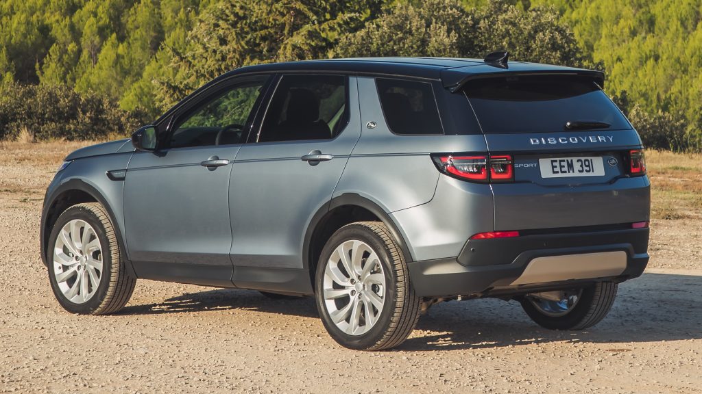 Metallic Range Rover Discovery is standing on a gravel road