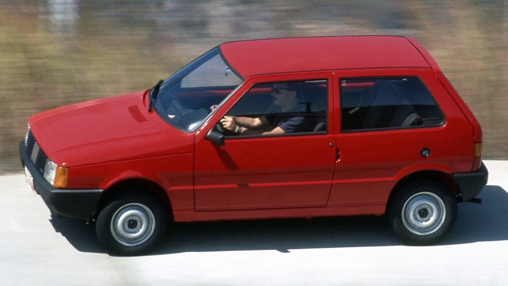 Side view of the 1990 Fiat Uno Mille in red