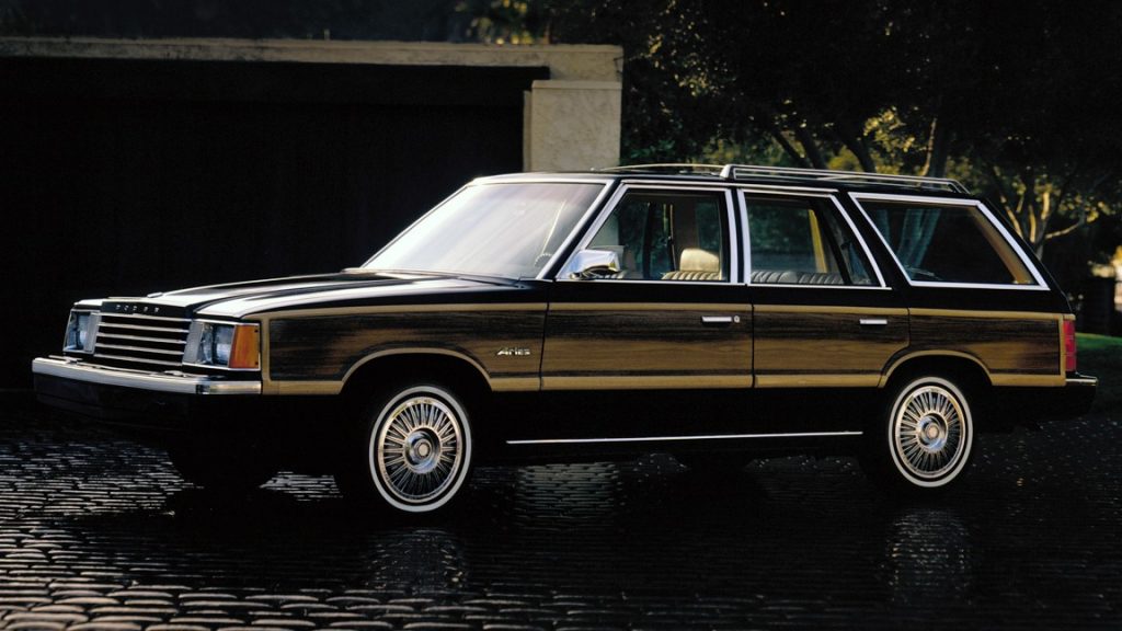 Side view of the 1981 Dodge Aries K in black with wooden accents